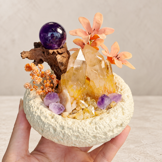 Handheld view of the citrine and amethyst garden showing its compact bowl size