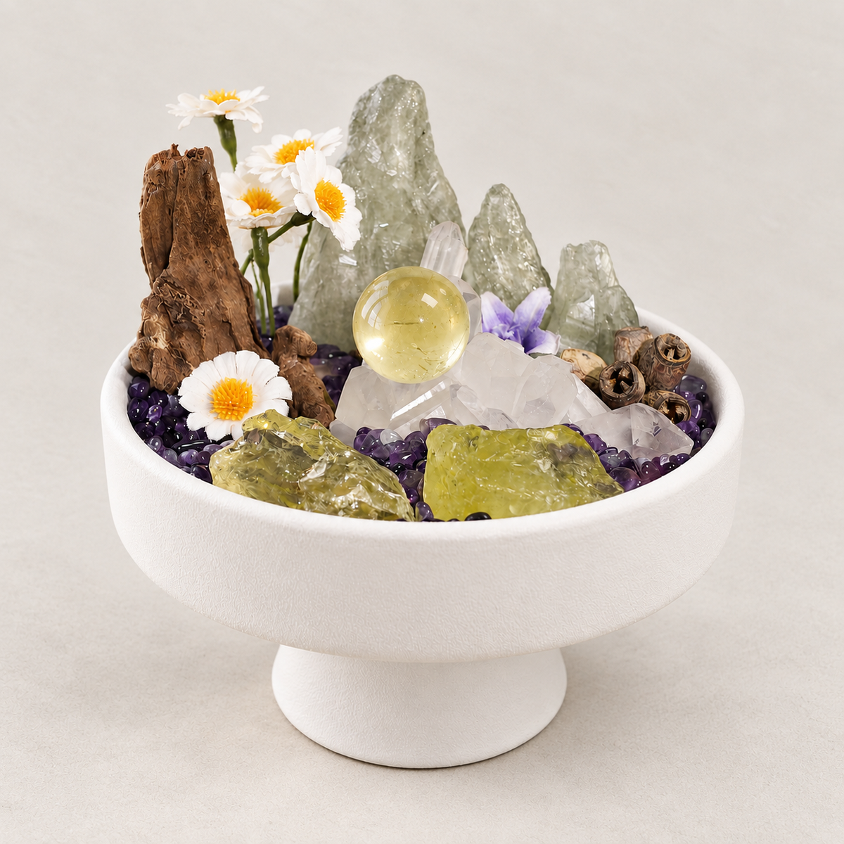 Daisy crystal garden with quartz cluster, golden sphere and green mountain forms in a white pedestal bowl