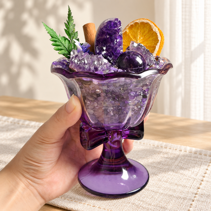 Purple glass pedestal crystal garden held in one hand to show scale