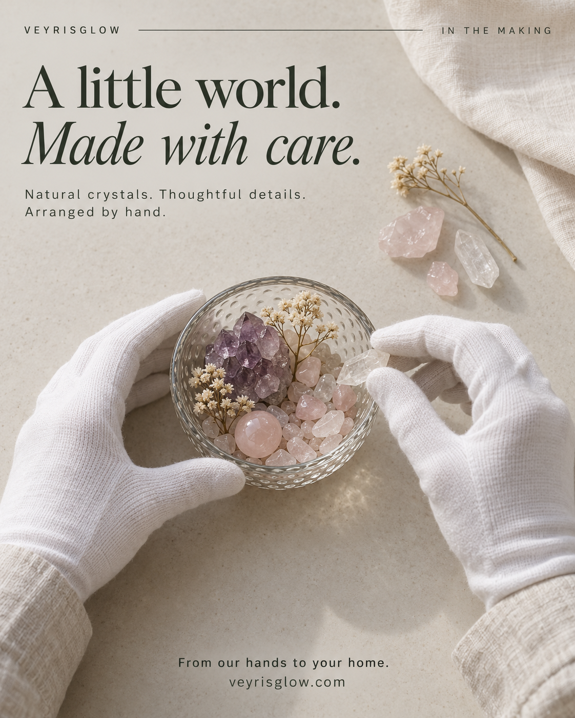 White-gloved hands arranging a crystal garden with amethyst, rose quartz and clear quartz.